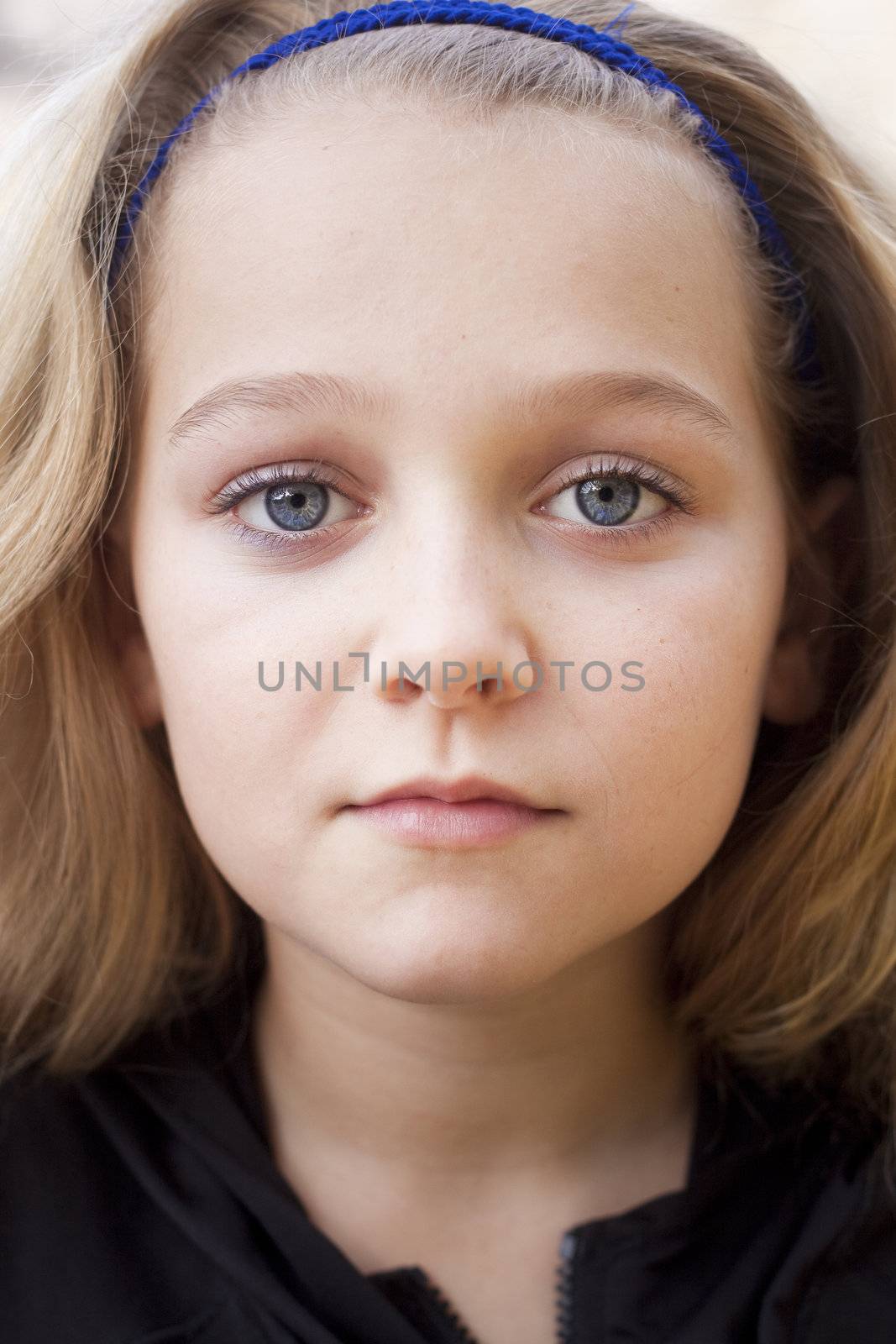 A beautiful serious child looking at the camera