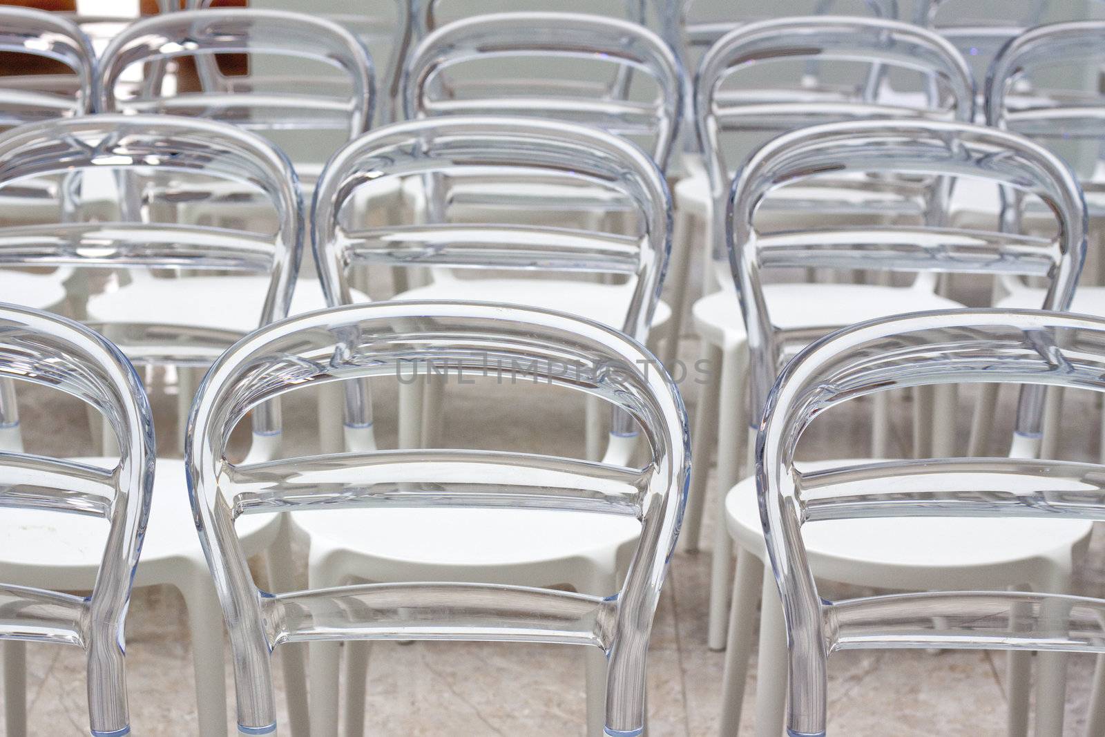 Rows of modern chairs in conference room