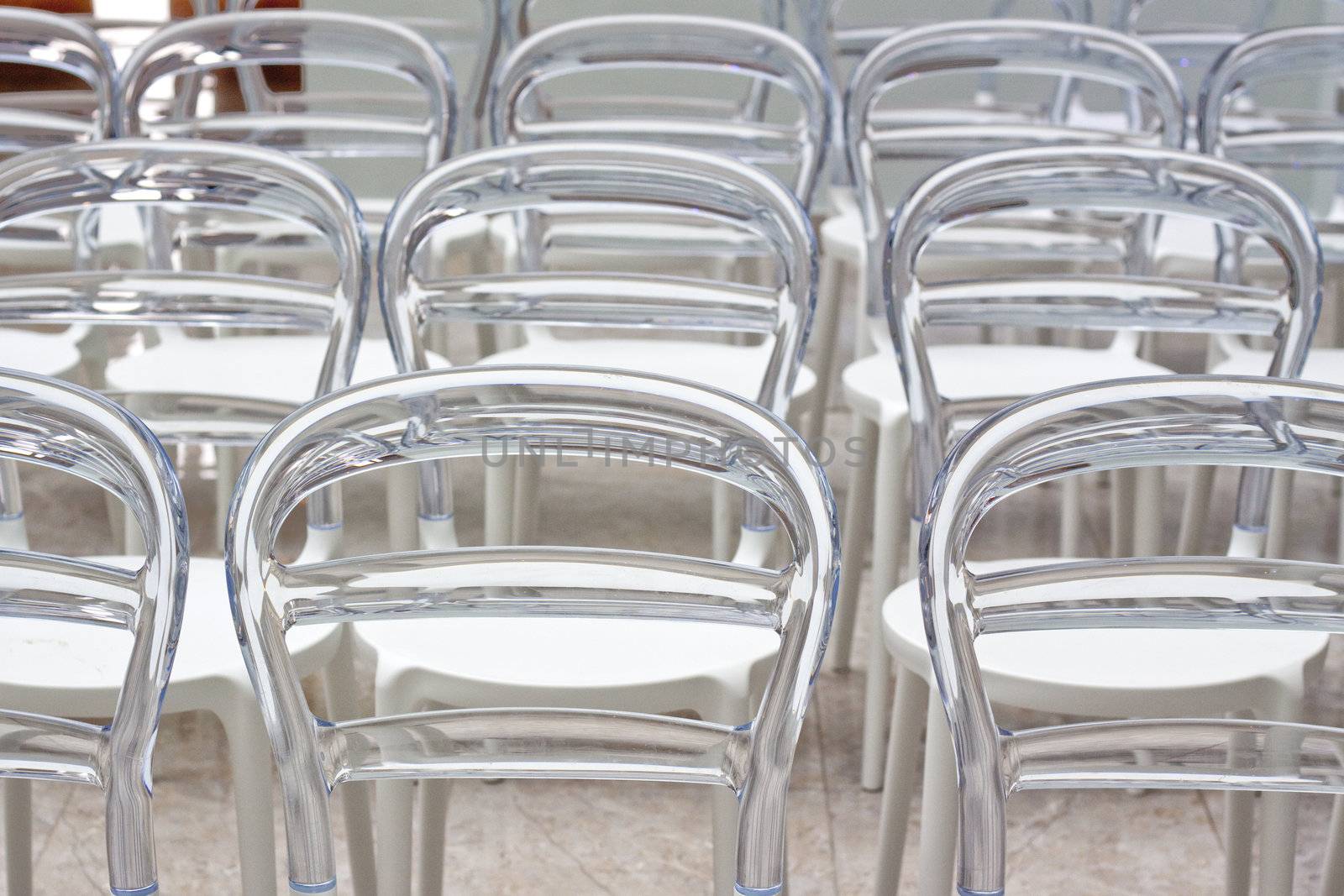Rows of modern chairs in conference room