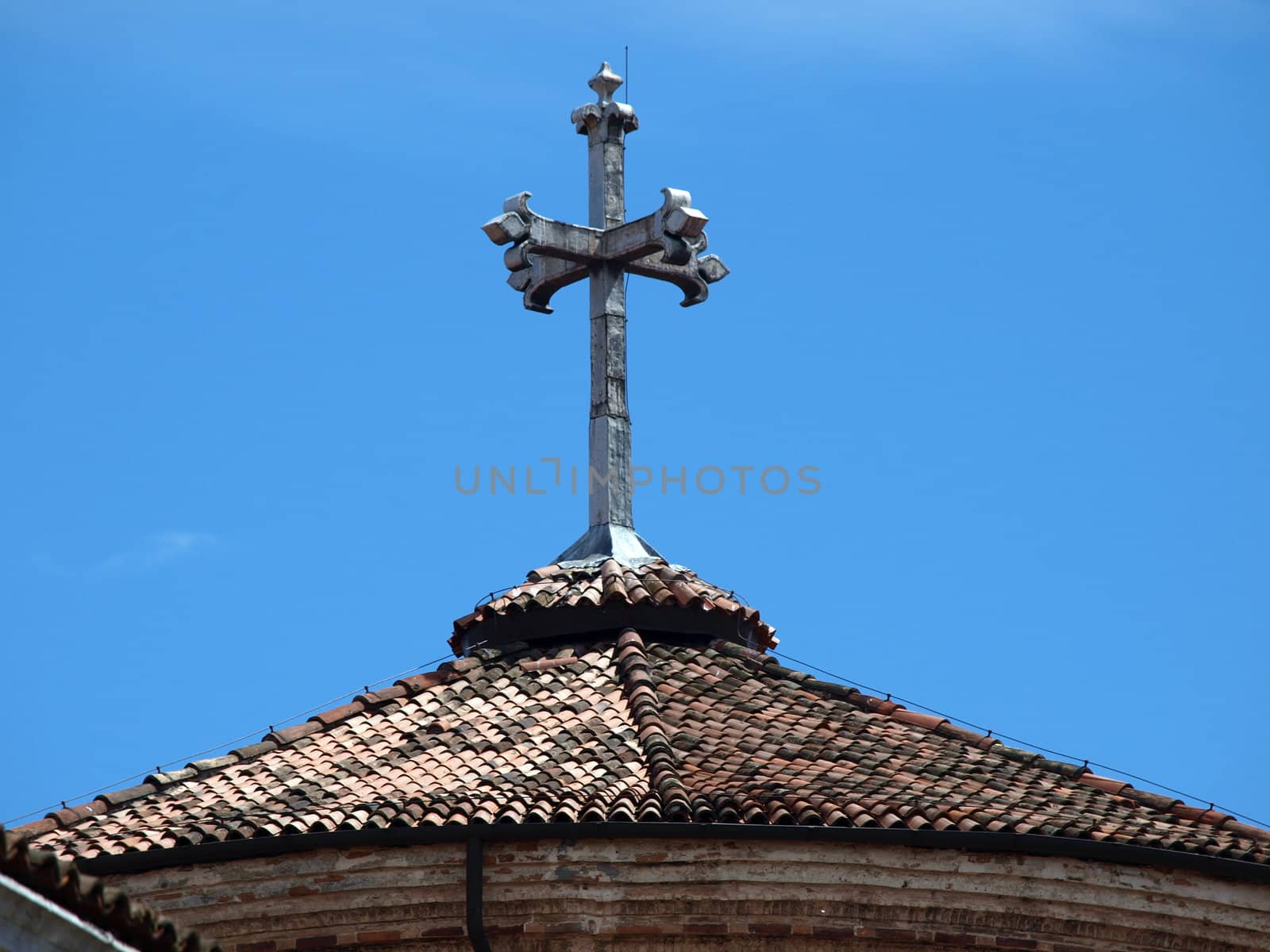 Venice - an old stone cross on the church roof