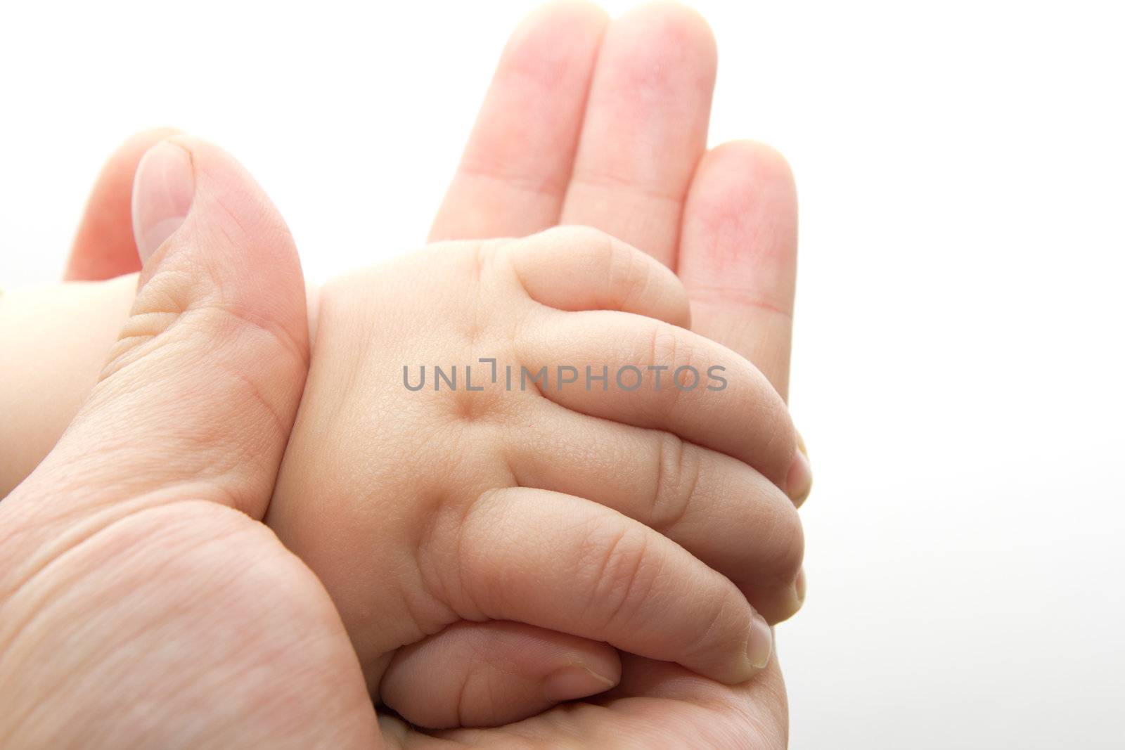 father's and baby's hands 