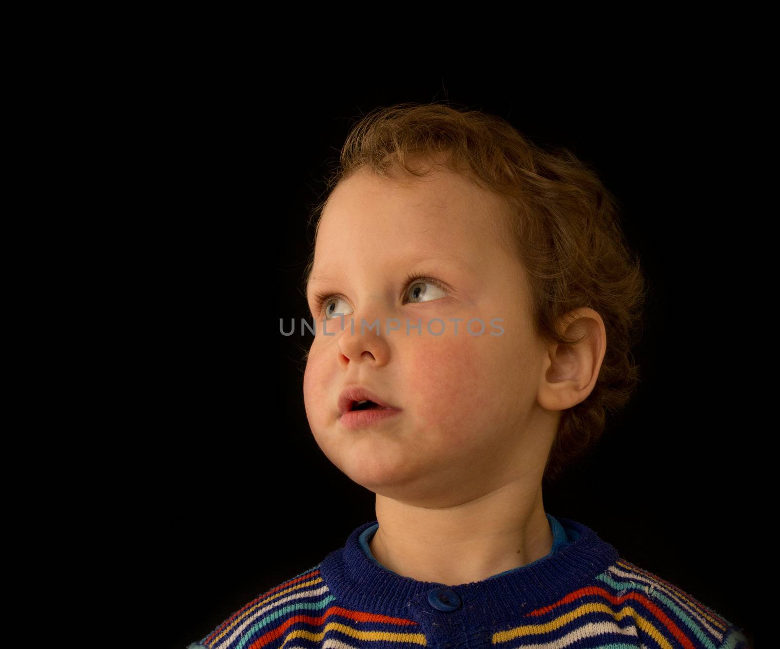 a portrait of a boy on a black background by schankz