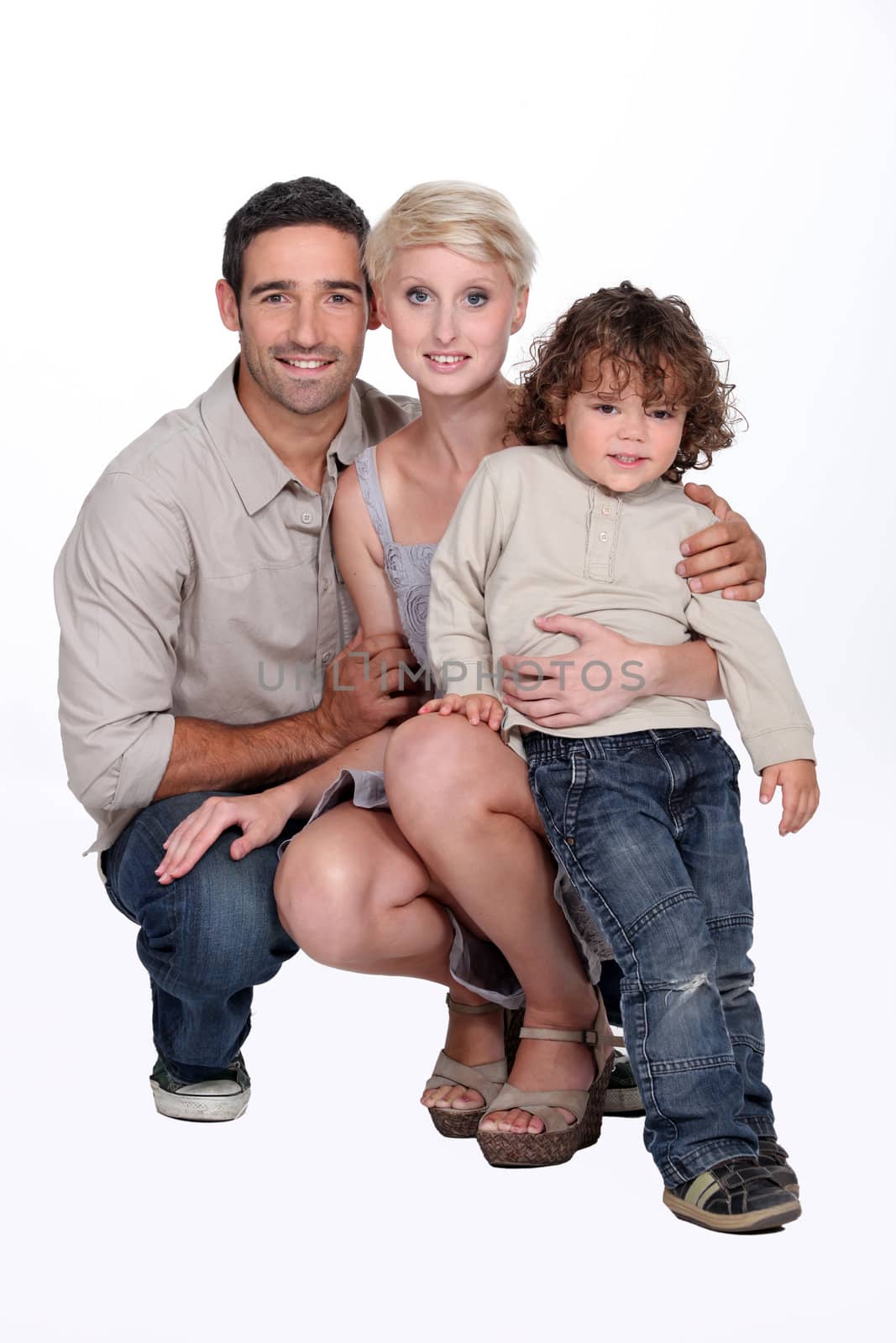 Portrait of parents with child by phovoir