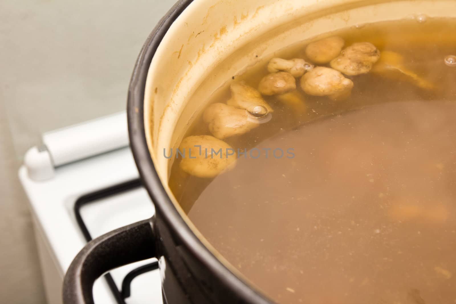 Mushrooms cook in a pan