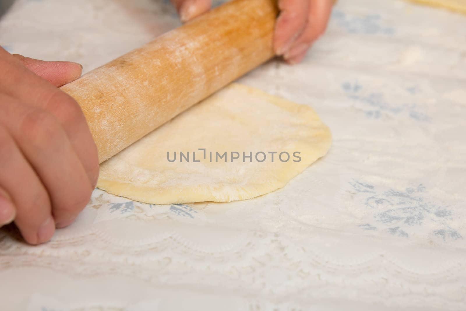 woman hands knead dough 
