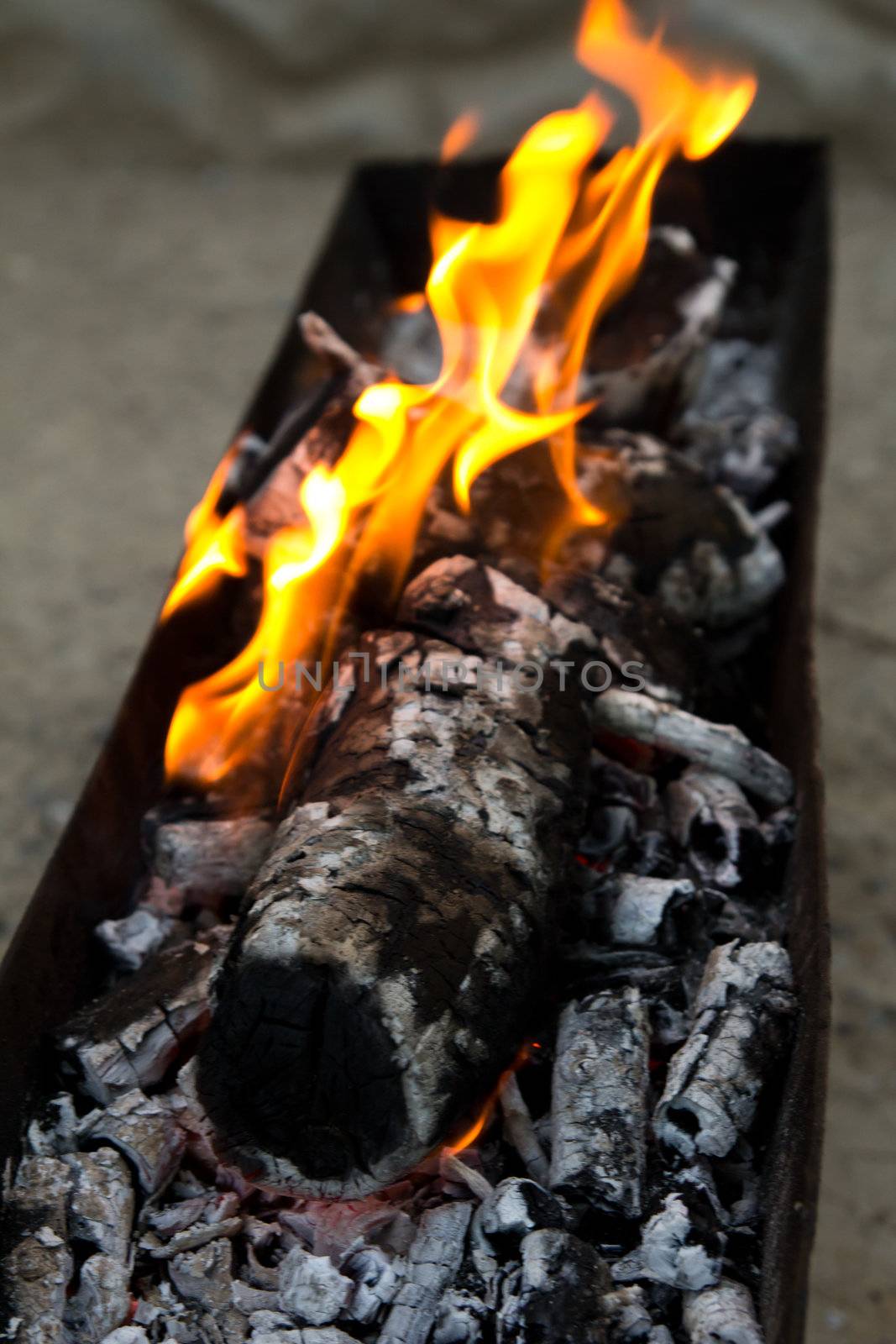 Fire, burning coal on a barbecue by schankz