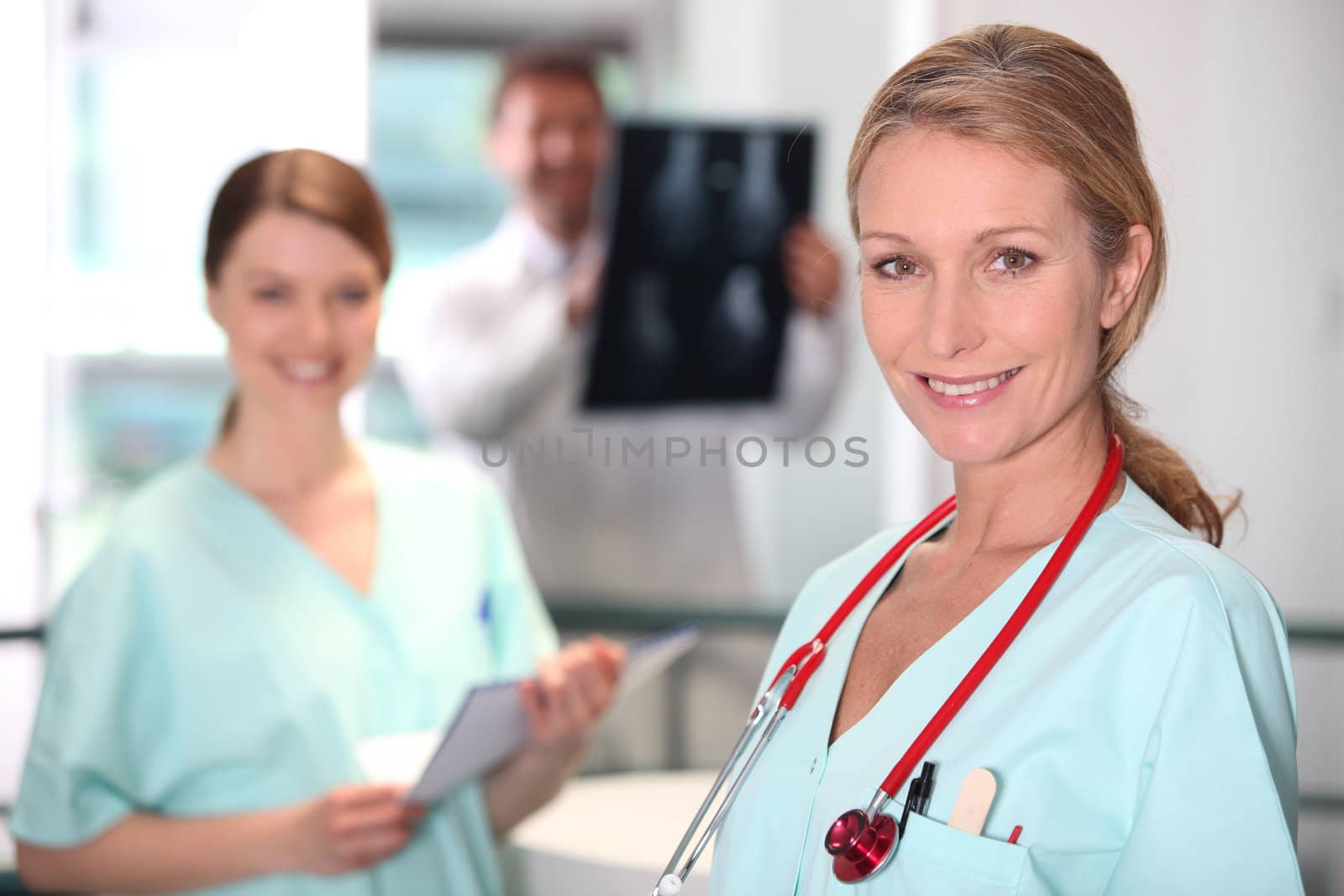 Female nurse in X-ray room.