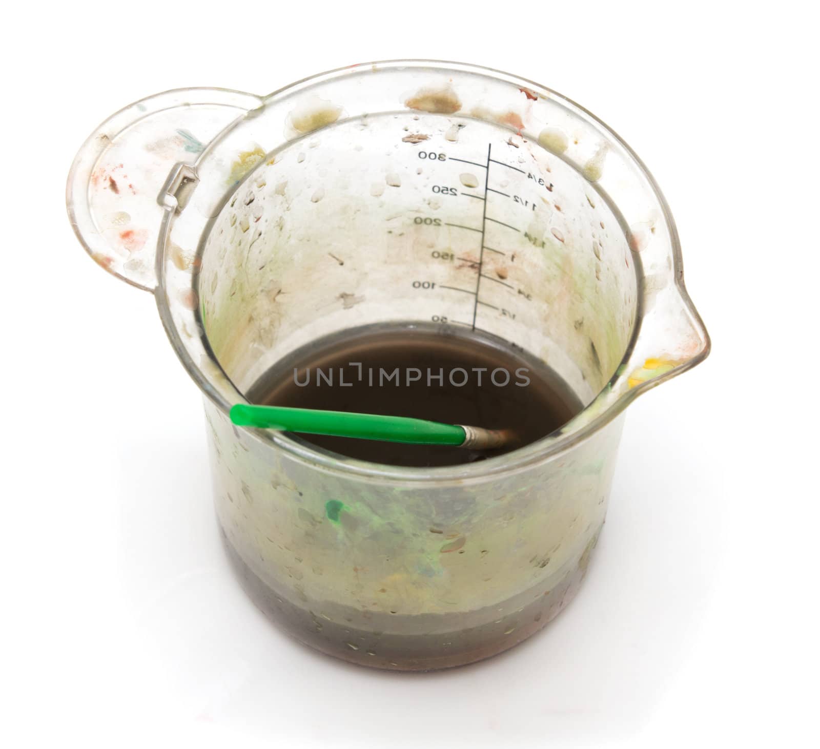 a glass of dirty water under the paint