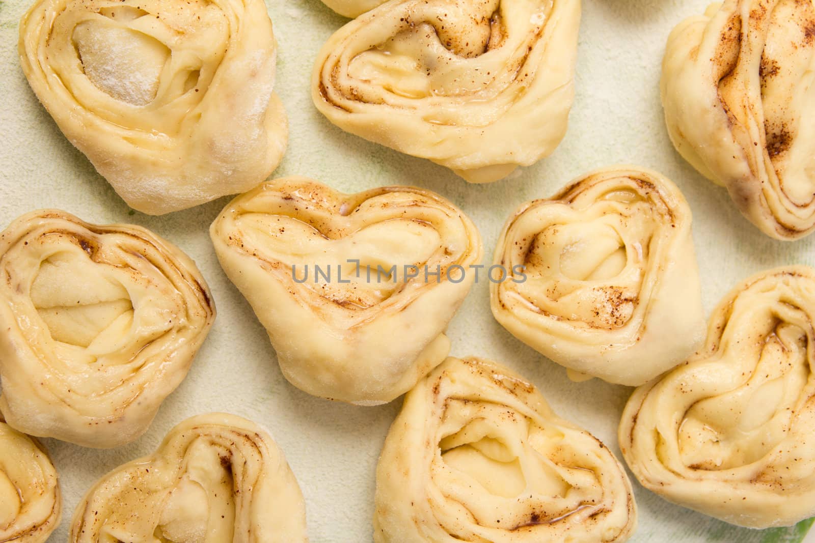 Half-finished product of a roll with cinnamon