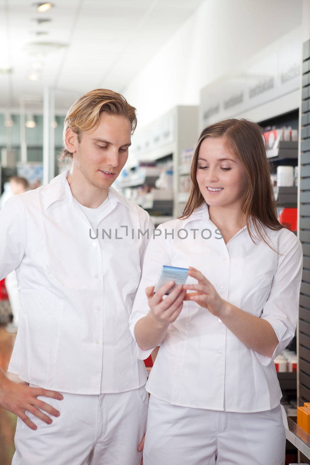 Two Pharmacists in Pharmacy by leaf
