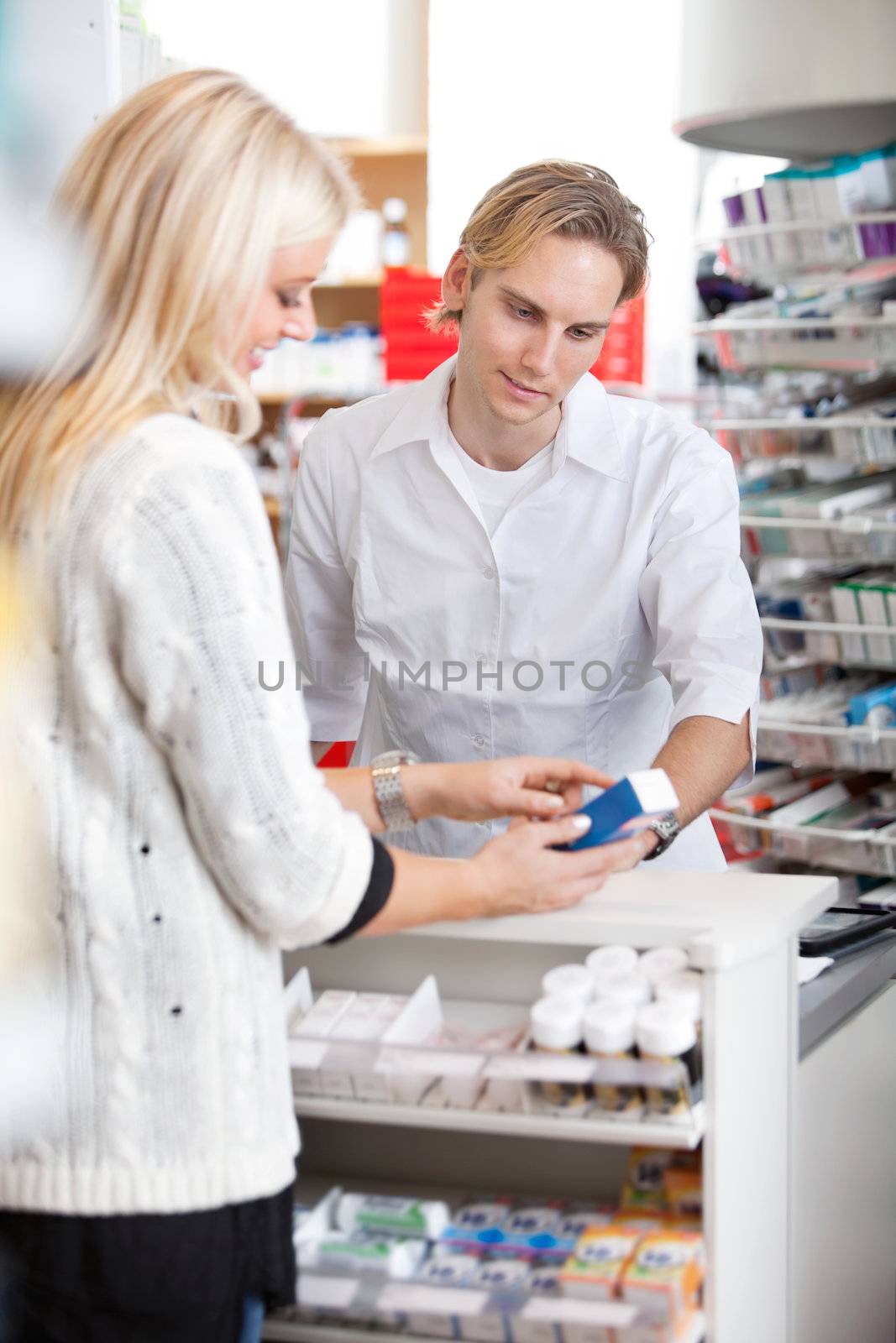 Pharmacist Helping Customer by leaf