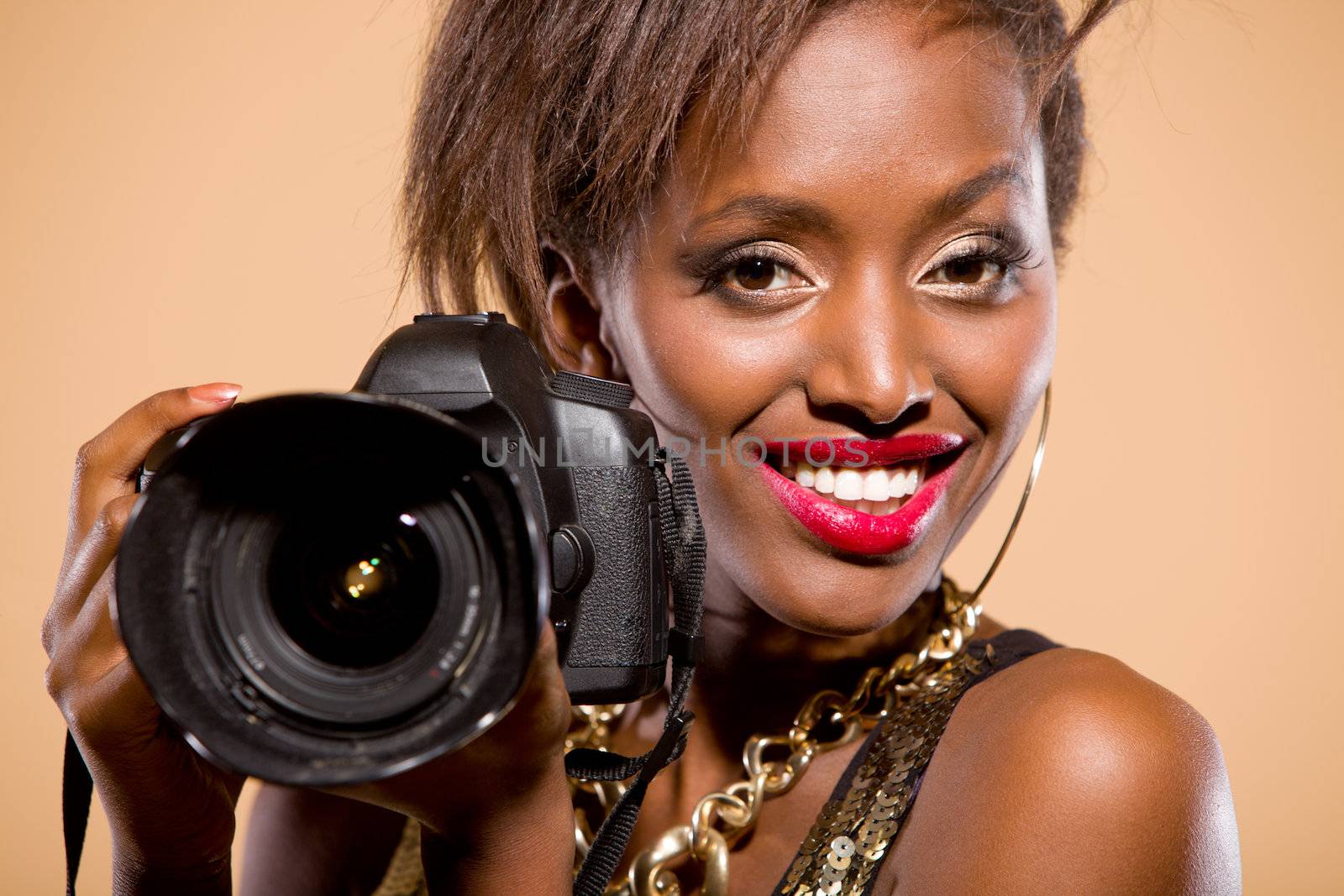 African american model holding DSLR camera