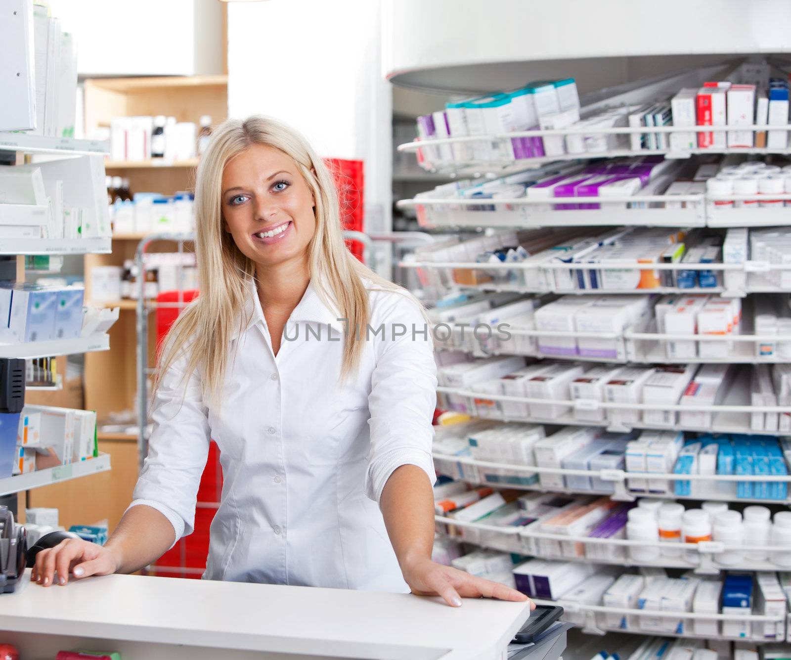 Female Pharmacist Standing at Checkout Counter by leaf