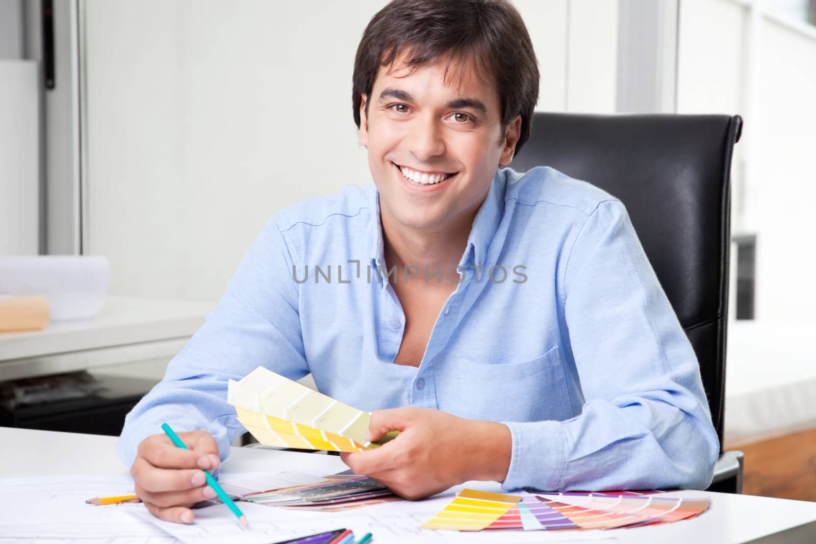 Male Interior Designer at Office by leaf