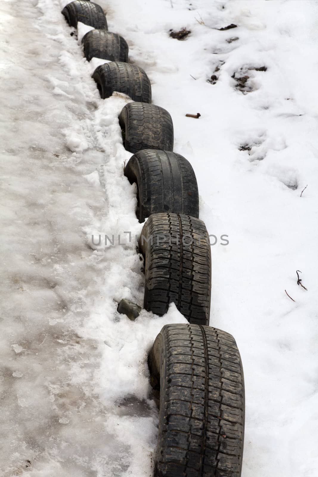 tires in the snow by schankz