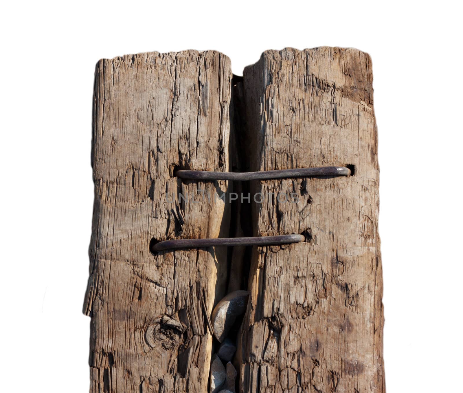 split sleeper connected by two rusty nails on a white background