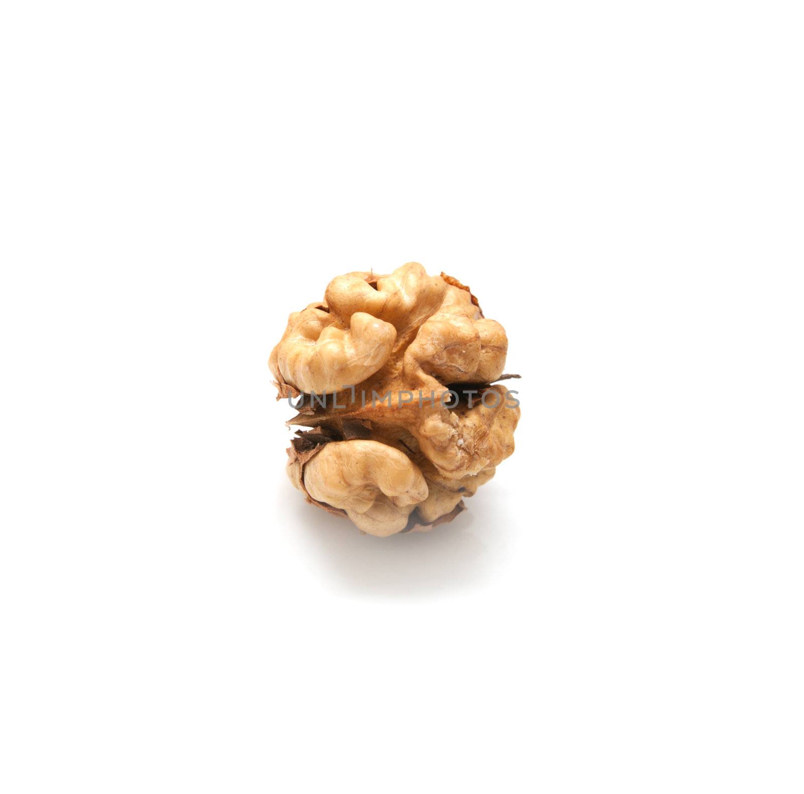 Crushed walnuts on white background 