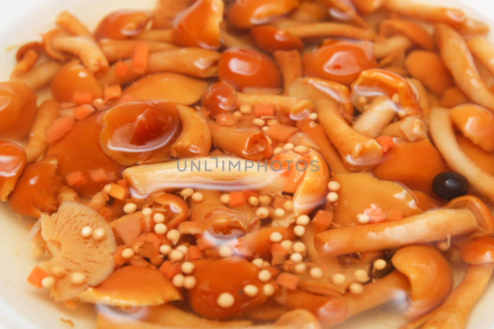 Marinated mushrooms in the background
