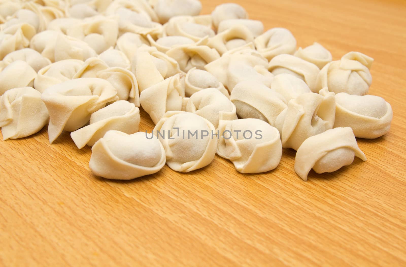 homemade meat dumplings on a cutting board 