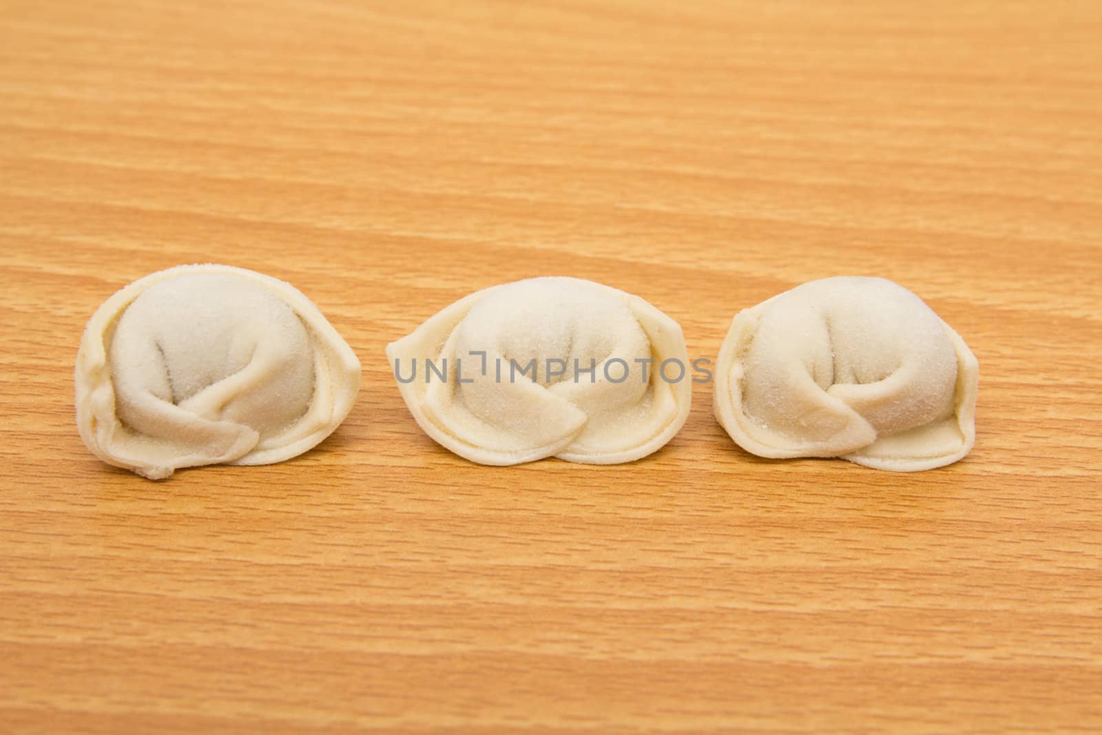 homemade meat dumplings on a cutting board 