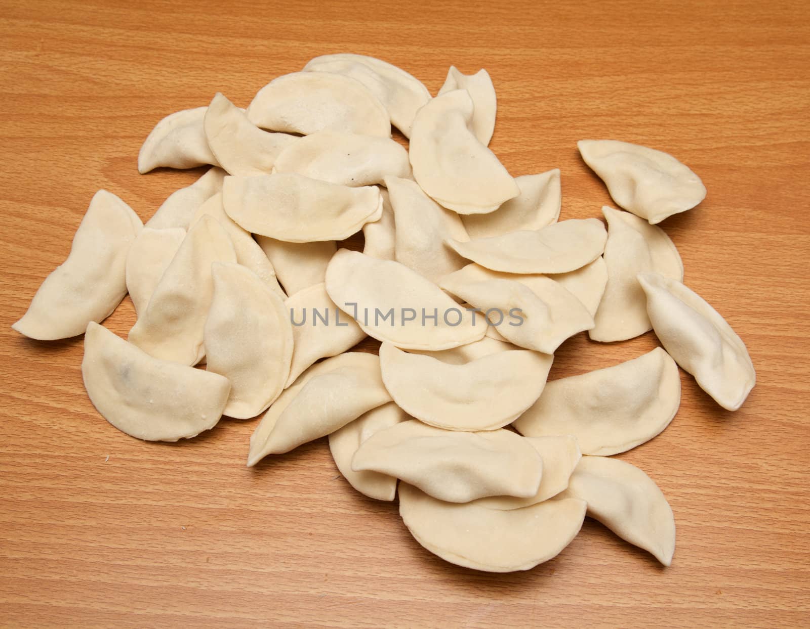 homemade meat dumplings on a cutting board 