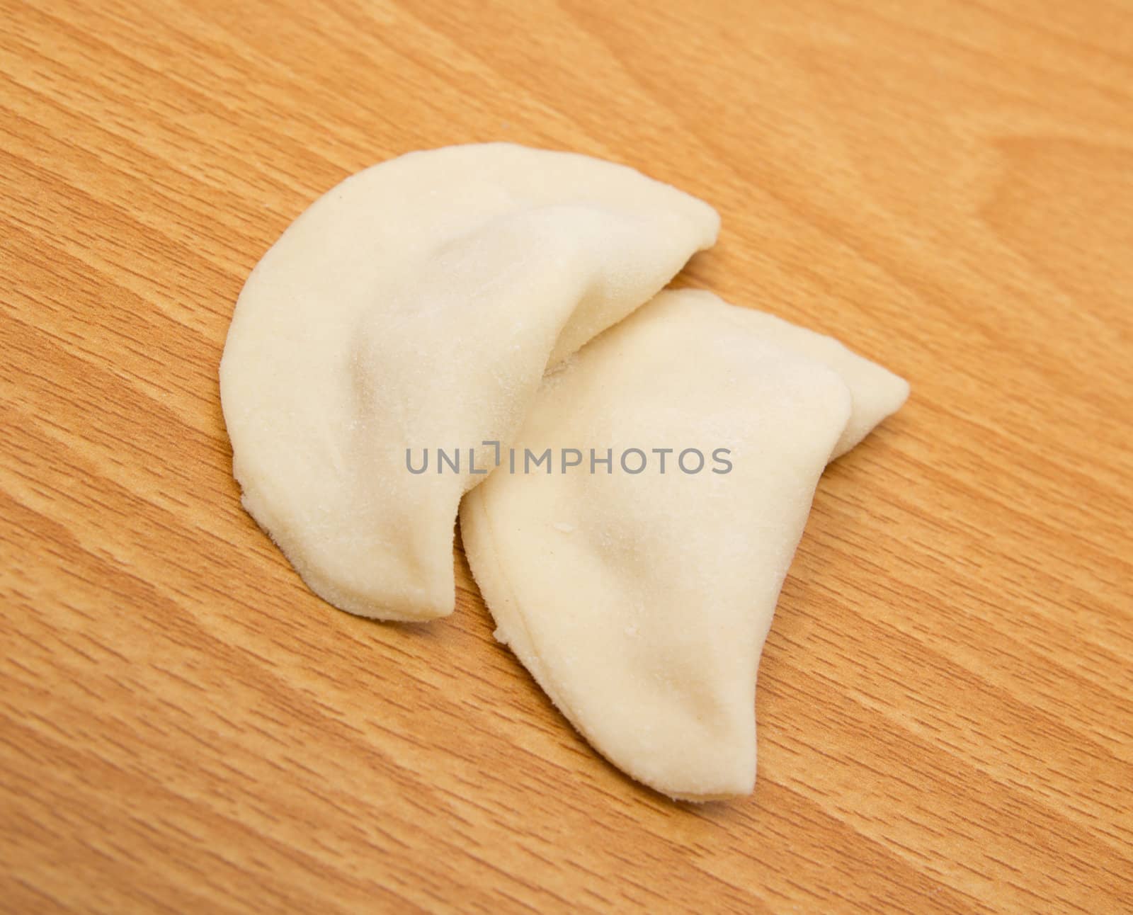 homemade meat dumplings on a cutting board 