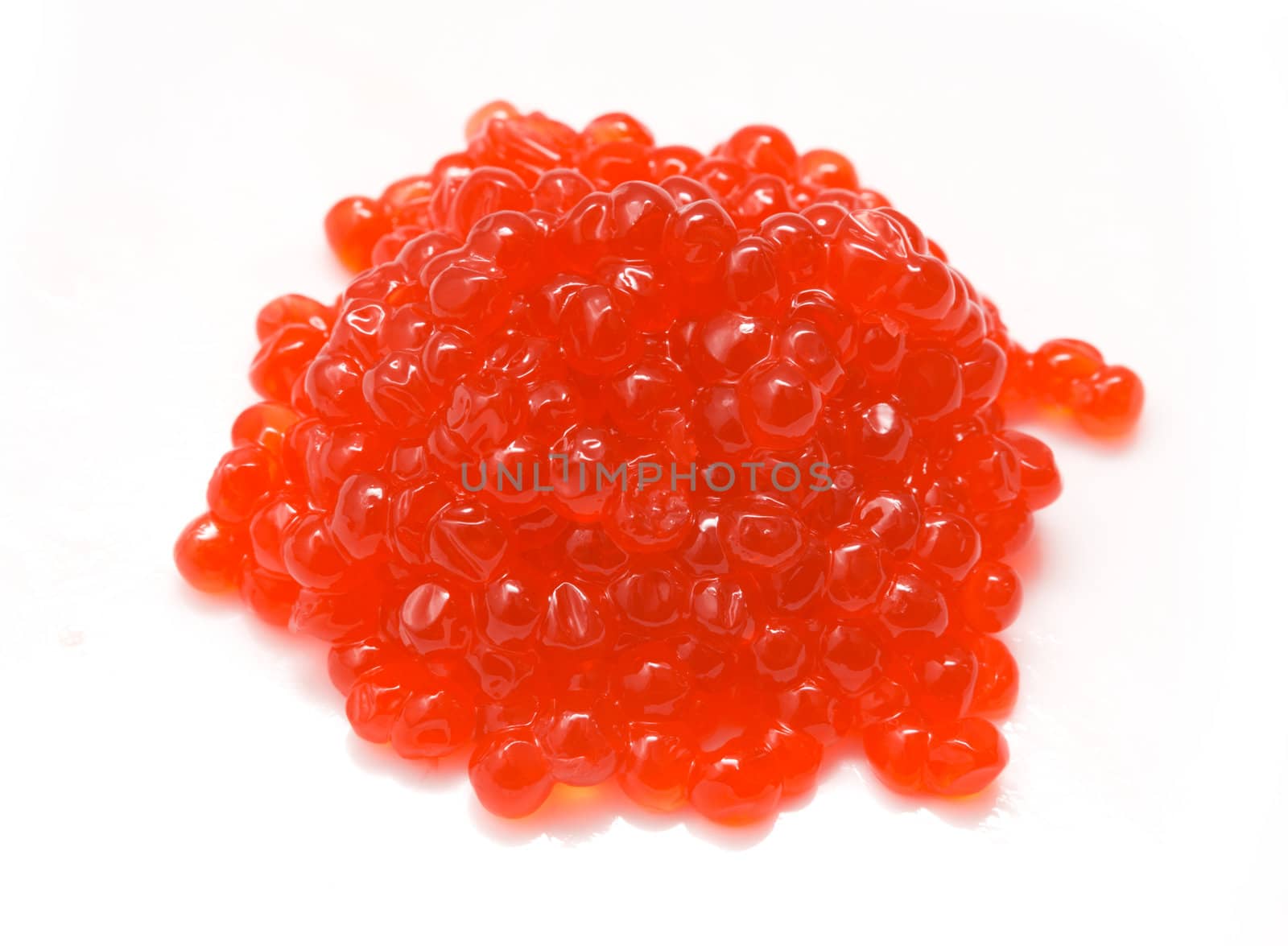 Red salmon caviar heap isolated on white 