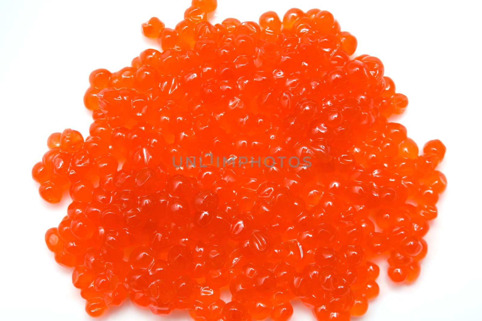 Red salmon caviar heap isolated on white 