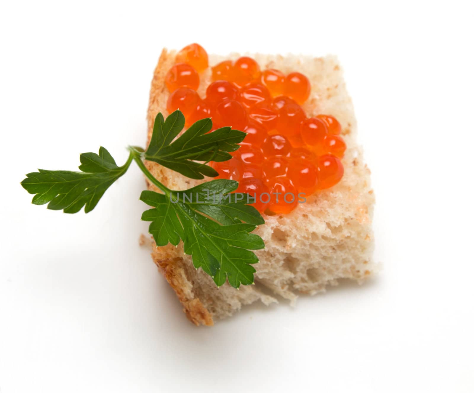 red caviar on bread with parsley