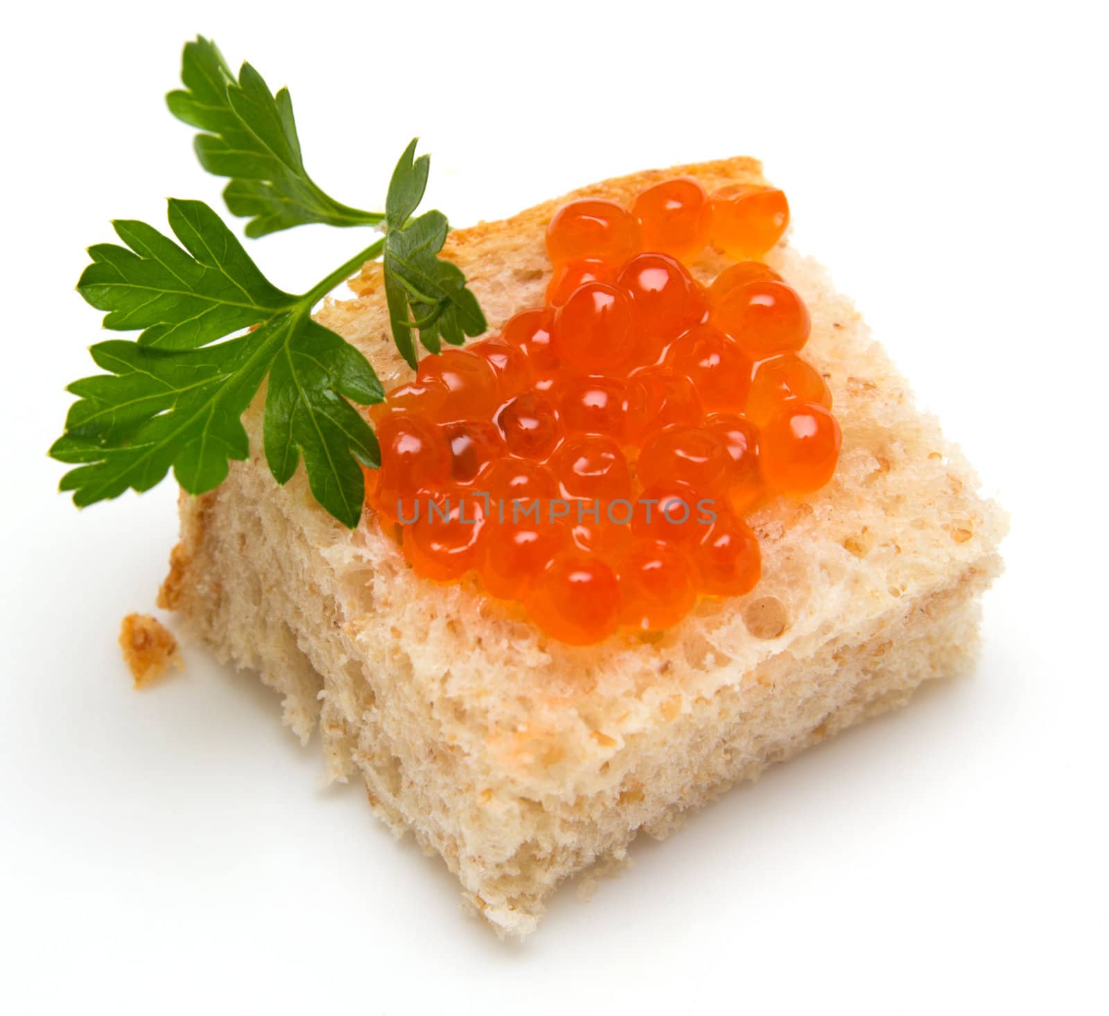 red caviar on bread with parsley