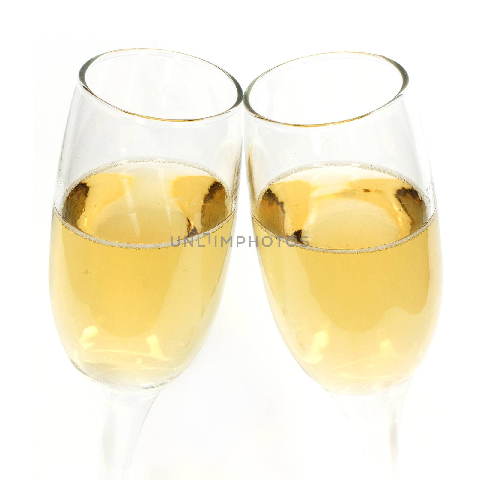 Pair of champagne glasses making a toast by schankz