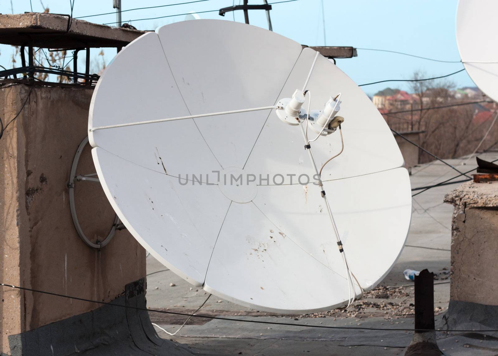 Satellite dish with sky on roof  by schankz