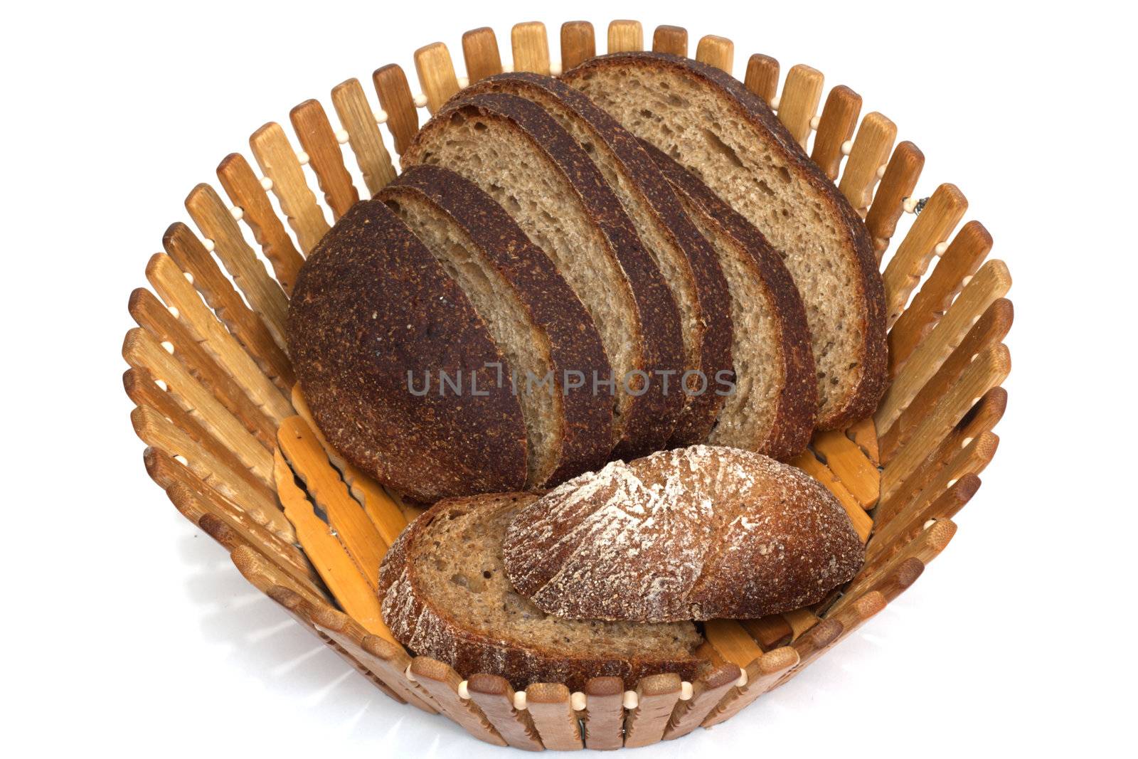 Black bread on board on white background  by schankz
