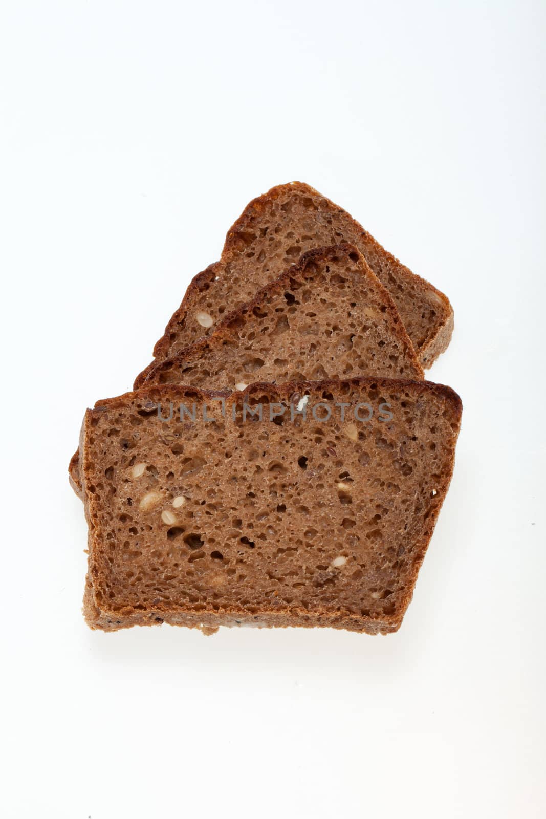 Slices of dark bread isolated over white 