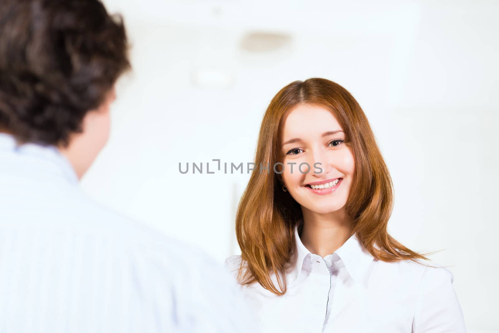 Attractive woman talking with a man, close up portrait