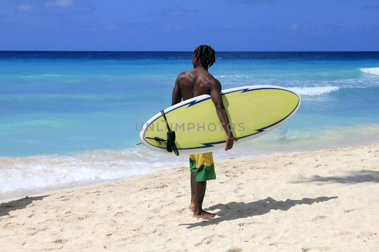 Surfer on a coastline expecting the big wave. Barbados
