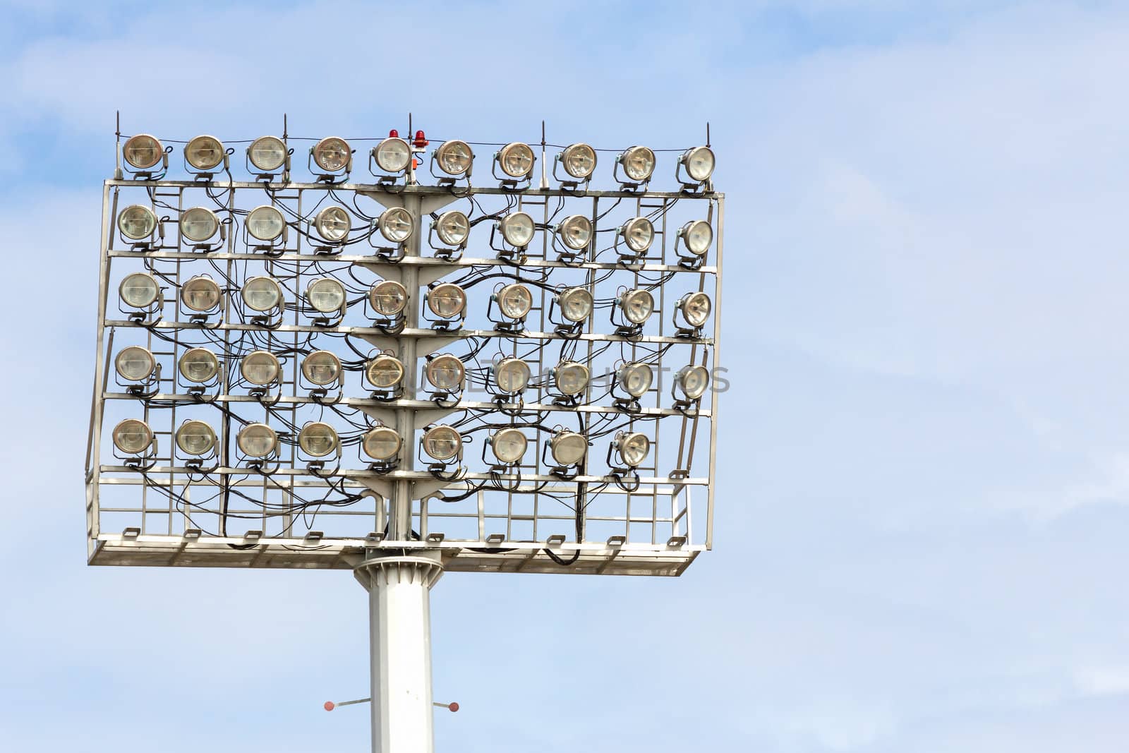 The Stadium Spot-light tower over Blue Sky