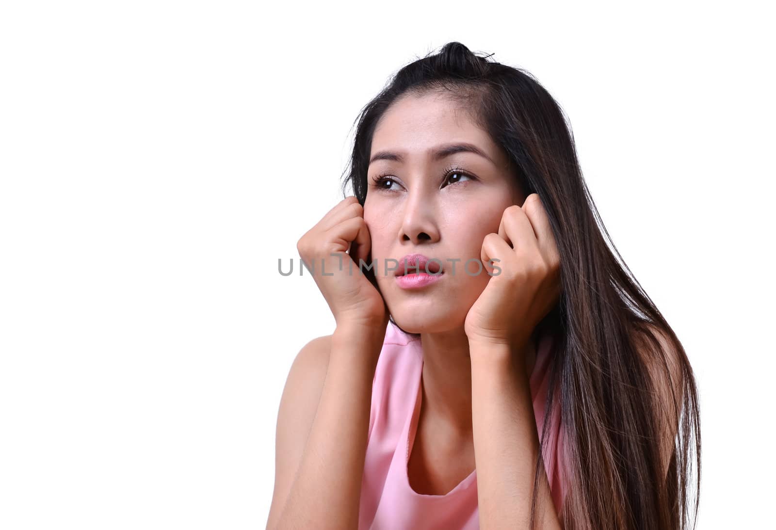 Sad beautiful woman standing against a white background