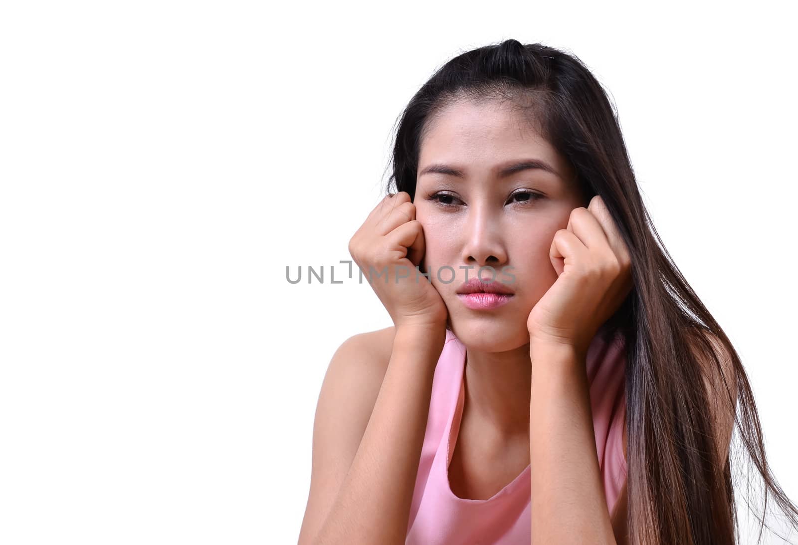 Sad beautiful woman standing against a white background