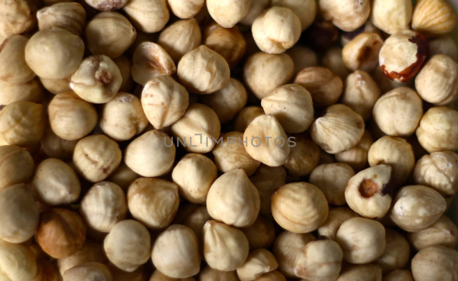 Macro of raw fresh uncooked hazelnuts