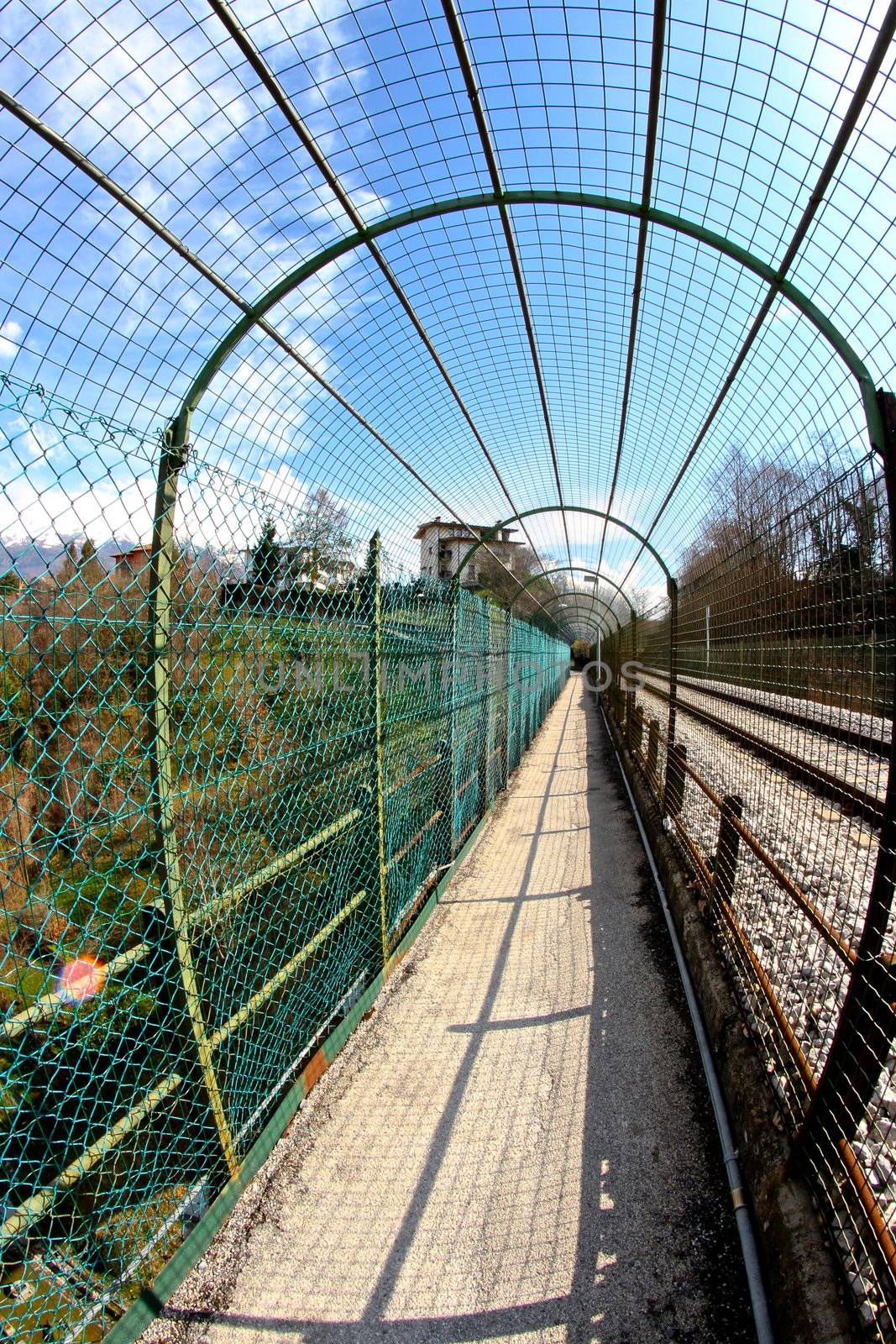 long pedestrian tunnel near by the train railway in Belluno by lifeinapixel