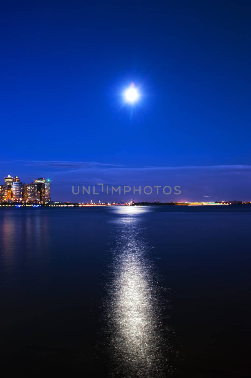 the moon and Manhattan from New Jersey side
