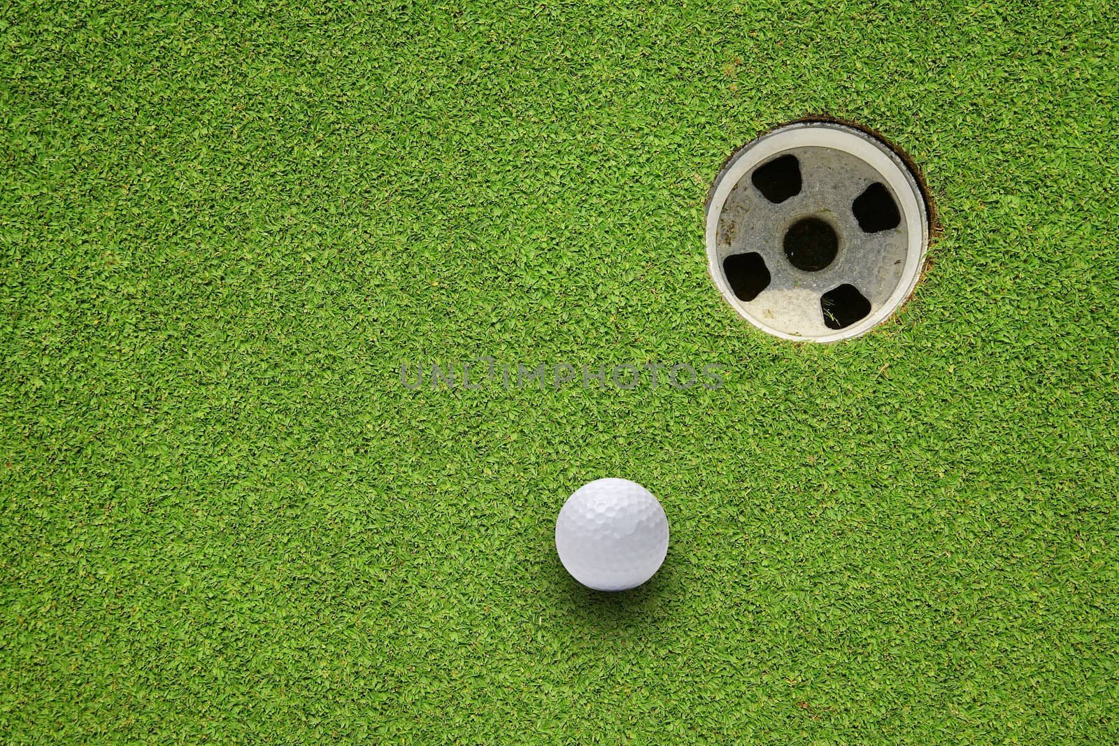 Golf ball very close to the hole