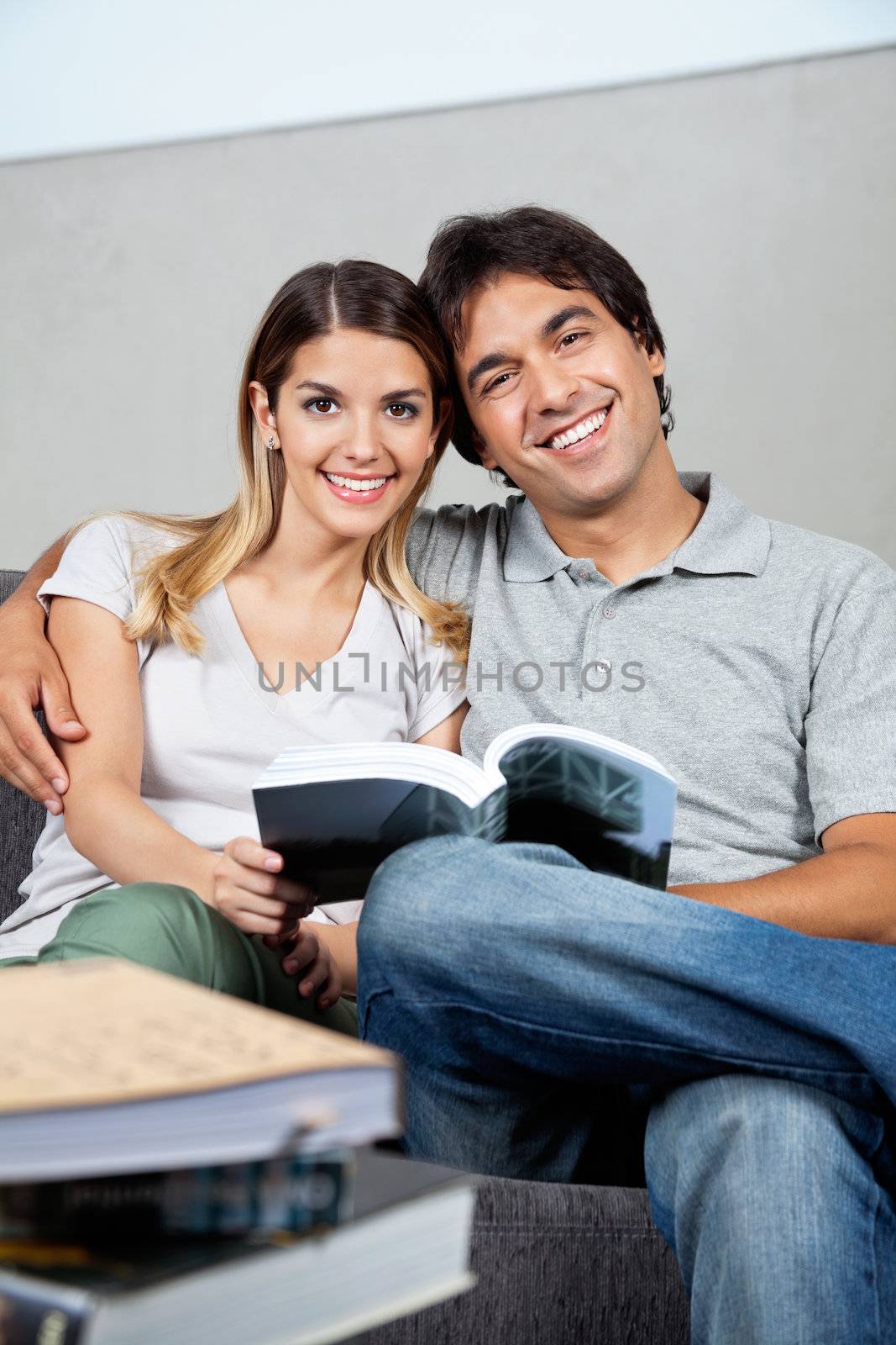 Couple With Book by leaf