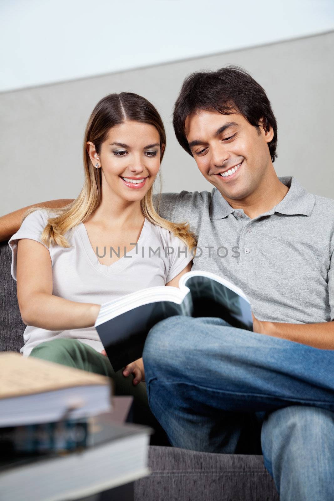 Couple Reading Book by leaf