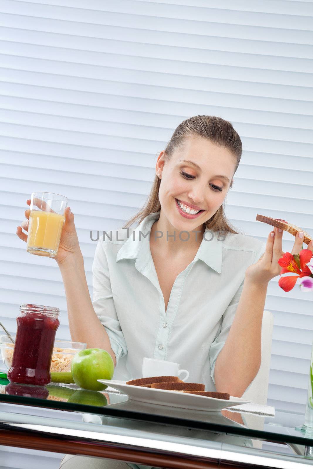 Happy Woman Having Orange Juice by leaf