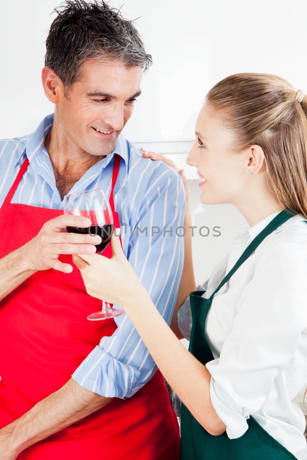 Happy Couple Cooking in Kitchen by leaf