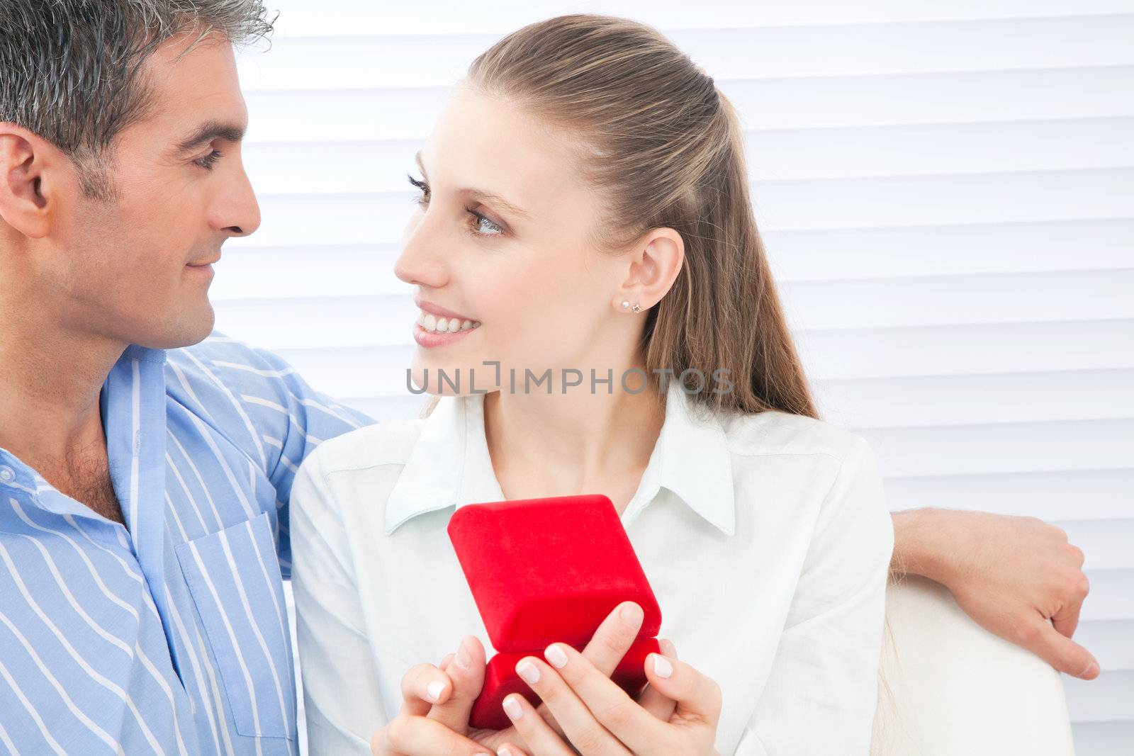 Couple Holding Box Ring by leaf