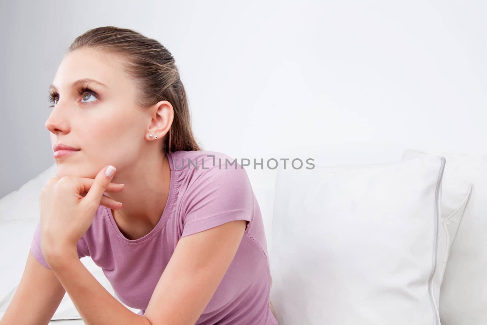 Young Woman Looking Away by leaf