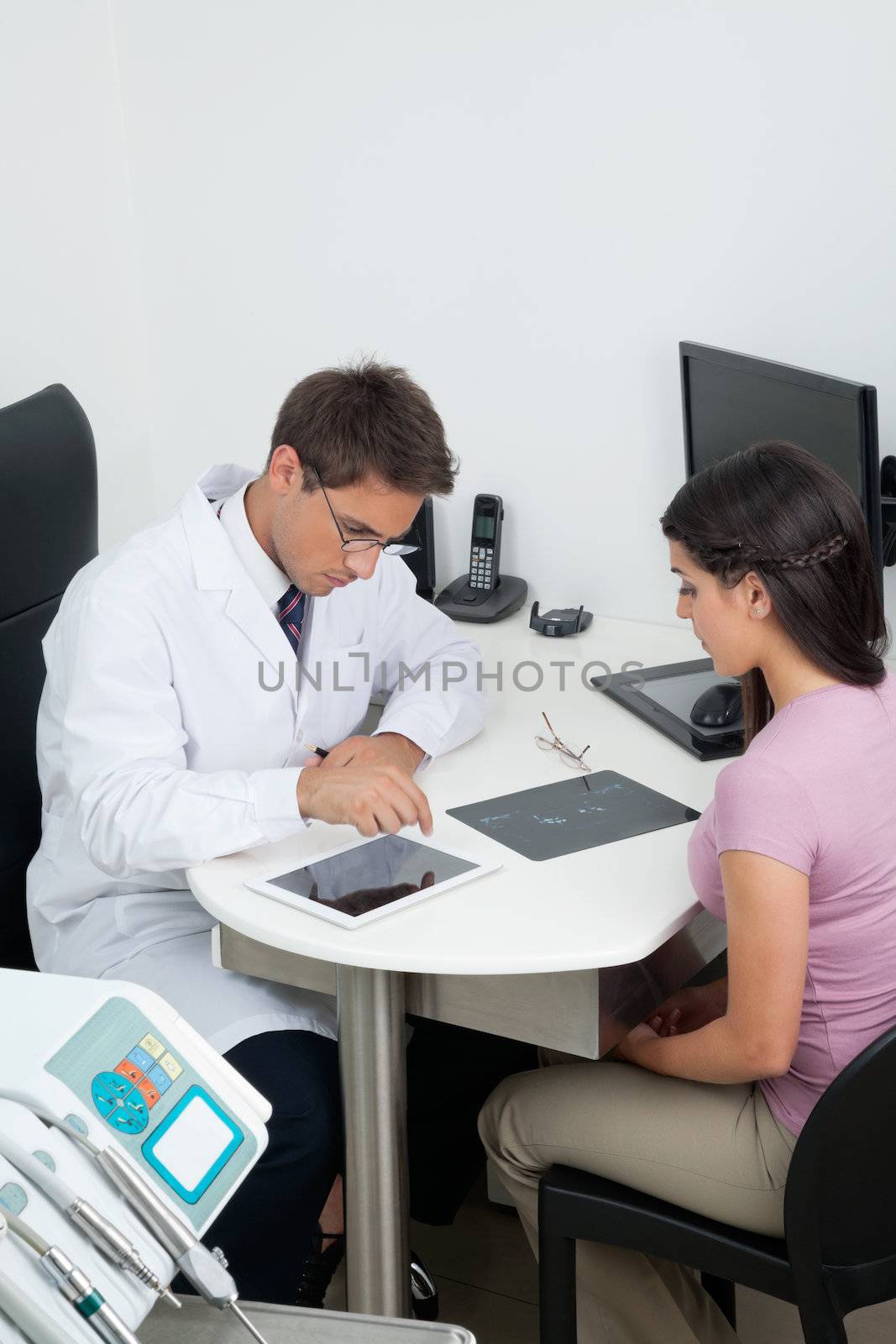 Patient Visiting Dentist In Clinic by leaf